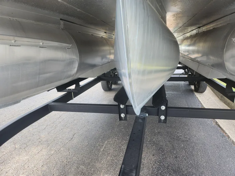 Slide: The Image of Underneath view of a 2022 Lowe SS 210 CL pontoon boat on a trailer. - 7