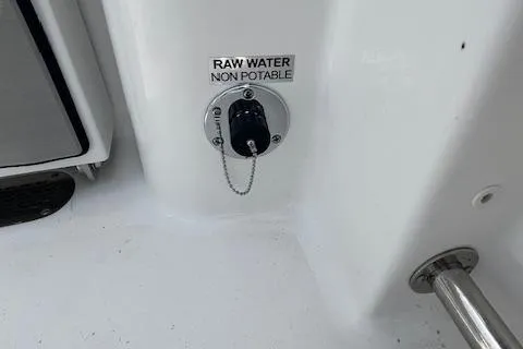 Slide: The Image of Sea Pro 242 DLX 2025 boat raw water outlet, labeled non-potable. - 14