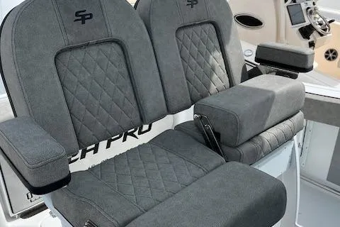 Slide: The Image of 2025 Sea Pro 242 DLX boat seats with quilted design and armrests. - 7