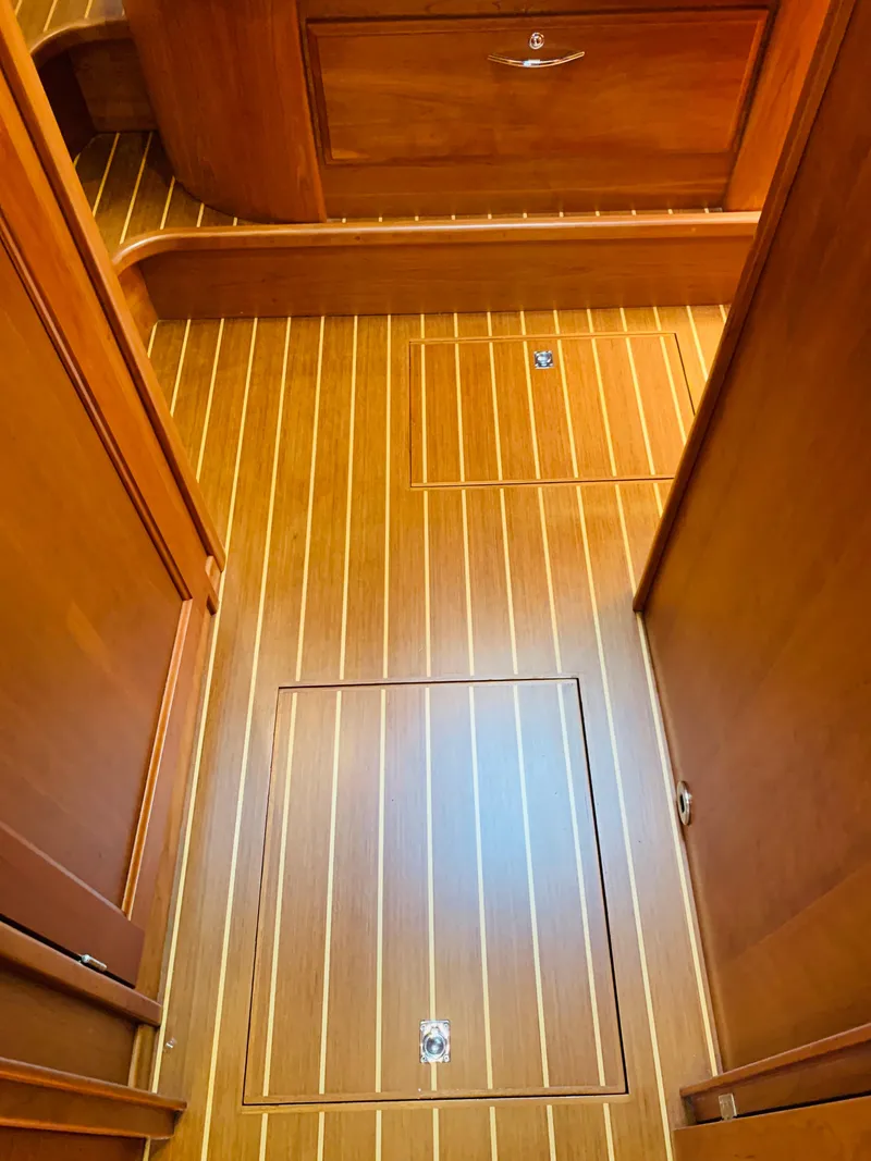 Slide: The Image of 2014 Sabre 48 Salon Express interior with polished wood flooring and cabinetry. - 21