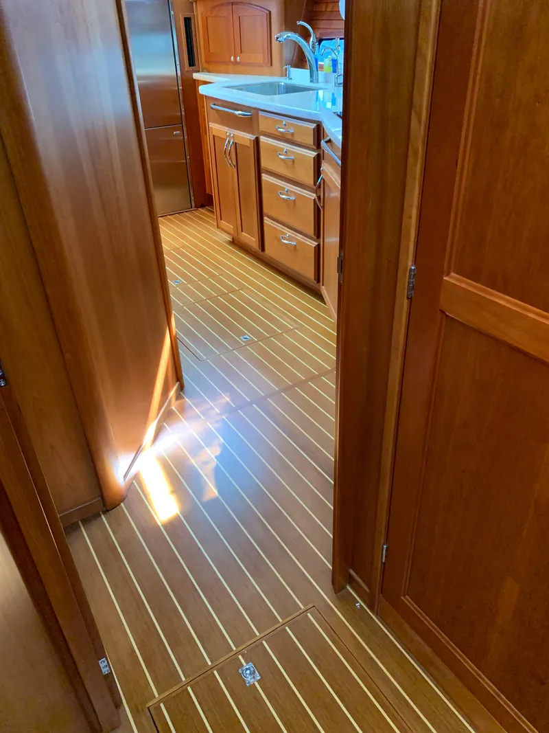 Slide: The Image of Interior of 2014 Sabre 48 Salon Express yacht with wooden flooring and cabinetry. - 31