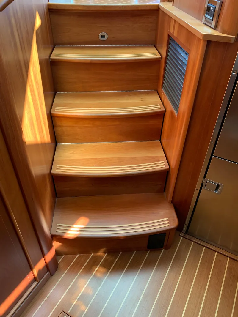 Slide: The Image of Wooden staircase inside 2014 Sabre 48 Salon Express yacht, featuring elegant design and craftsmanship. - 32