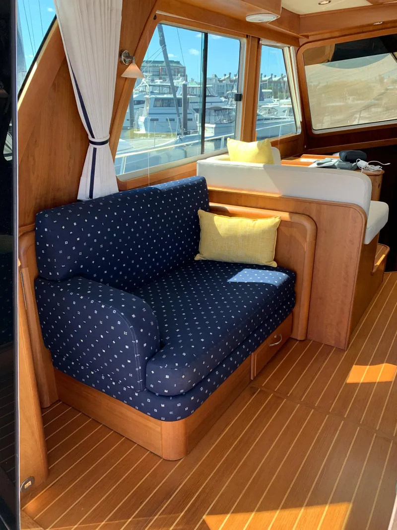 Slide: The Image of Interior of 2014 Sabre 48 Salon Express yacht with blue and yellow seating. - 35