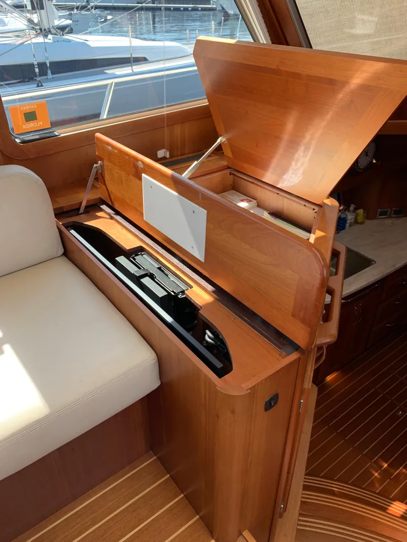 Slide: The Image of 2014 Sabre 48 Salon Express interior with wooden cabinetry and seating. - 40