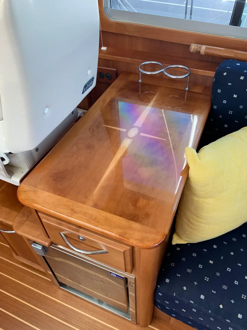 Slide: The Image of Interior of 2014 Sabre 48 Salon Express with wooden table and seating. - 47