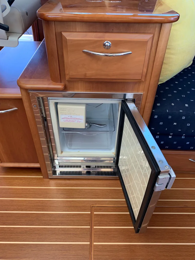 Slide: The Image of Open mini fridge in 2014 Sabre 48 Salon Express yacht interior. - 48