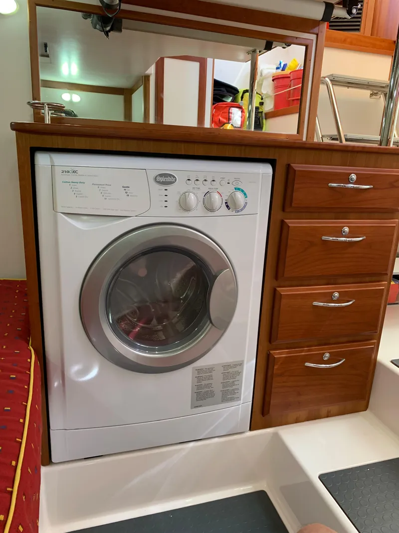Slide: The Image of Washing machine in 2014 Sabre 48 Salon Express yacht interior. - 51
