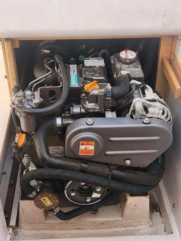 Slide: The Image of Engine compartment of a 2018 Catalina 275 Sport sailboat, showcasing mechanical components. - 42