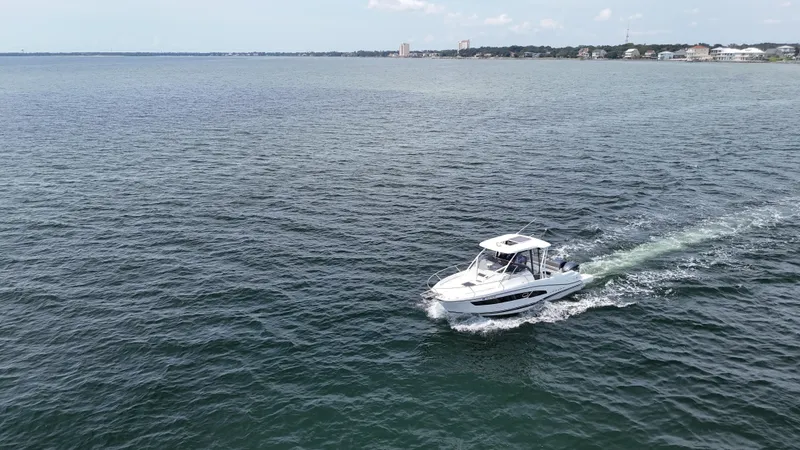 Slide: The Image of 2022 Jeanneau Leader 9.0 WA cruising on open water. - 1