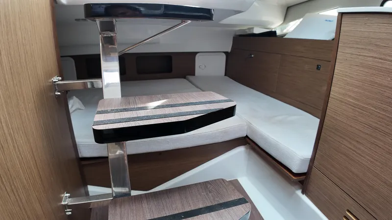 Slide: The Image of 2022 Jeanneau Leader 9.0 WA cabin interior with wooden steps and modern design. - 16