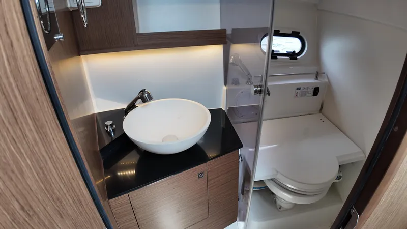 Slide: The Image of 2022 Jeanneau Leader 9.0 WA bathroom with modern sink and toilet. - 21