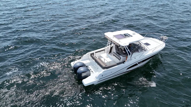 Slide: The Image of 2022 Jeanneau Leader 9.0 WA boat cruising on open water. - 6