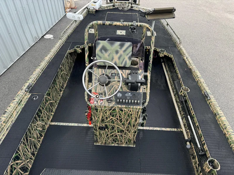 Slide: The Image of 2018 Prodigy 2172 Marsh Turf C boat with camouflage design and steering console. - 8