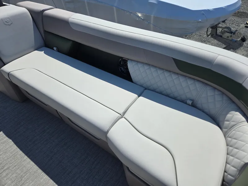 Slide: The Image of 2025 Godfrey Sweetwater 2286 C boat interior with plush seating and quilted accents. - 10