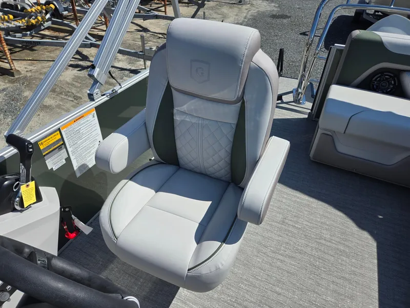 Slide: The Image of Captain's chair on 2025 Godfrey Sweetwater 2286 C pontoon boat, featuring plush upholstery. - 12