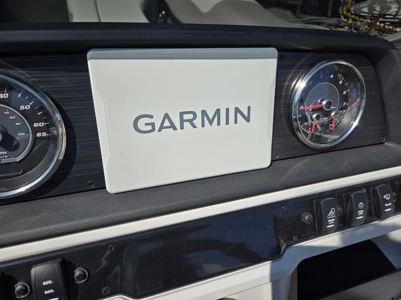 Slide: The Image of Dashboard of 2025 Godfrey Sweetwater 2286 C with Garmin display and gauges. - 14