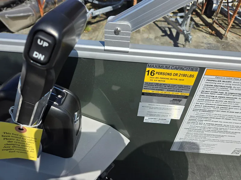 Slide: The Image of Control panel of 2025 Godfrey Sweetwater 2286 C boat, showing capacity and instructions. - 18