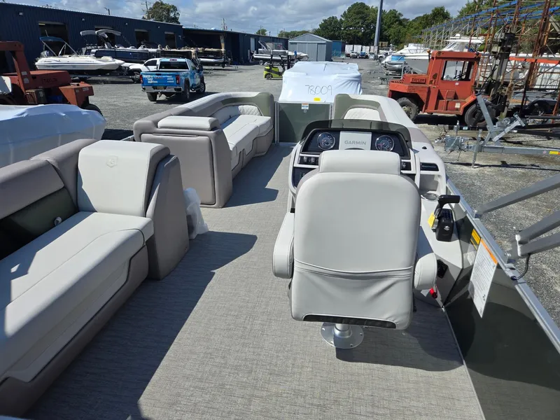 Slide: The Image of 2025 Godfrey Sweetwater 2286 C pontoon boat interior with seating and helm. - 28