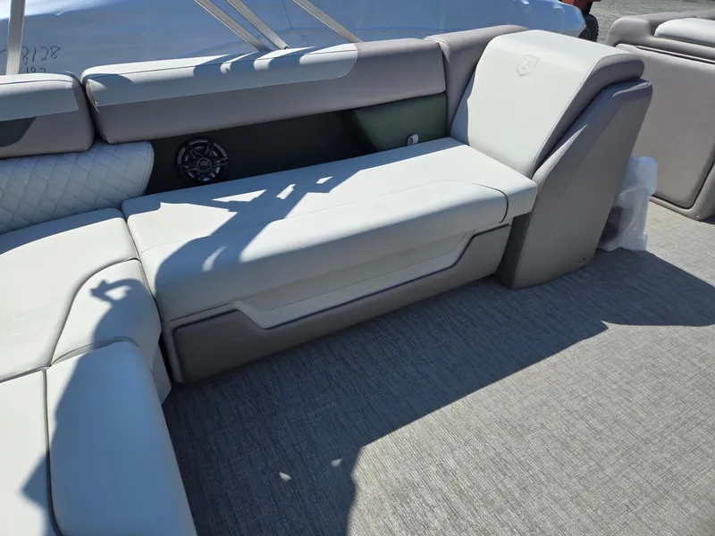 Slide: The Image of 2025 Godfrey Sweetwater 2286 C boat interior with gray seating and carpeted floor. - 29
