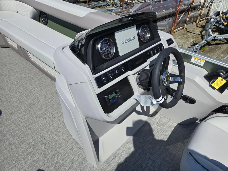 Slide: The Image of 2025 Godfrey Sweetwater 2286 C boat dashboard with Garmin navigation system. - 31