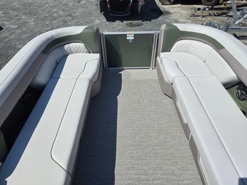 Slide: The Image of 2025 Godfrey Sweetwater 2286 C pontoon boat interior with plush seating and carpeted floor. - 36