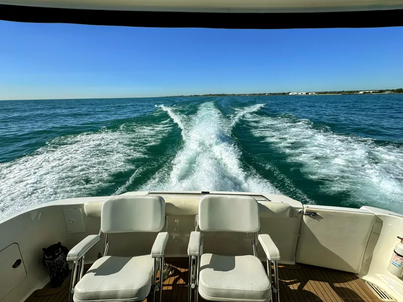 Slide: The Image of 2001 Sea Ray 400 Sedan Bridge cruising, leaving a wake in the ocean. - 24