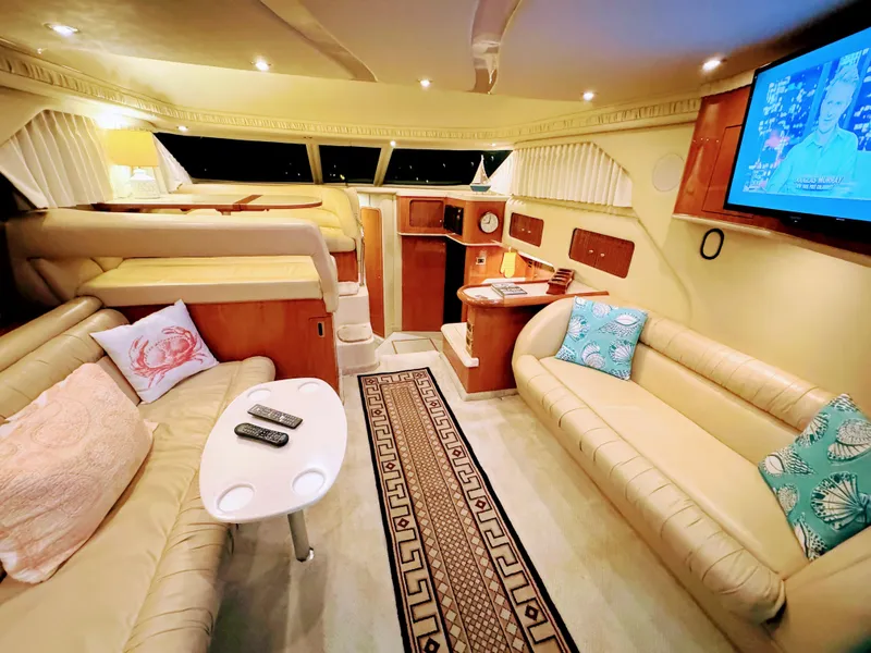 Slide: The Image of Luxurious interior of 2001 Sea Ray 400 Sedan Bridge yacht with cozy seating and modern amenities. - 39