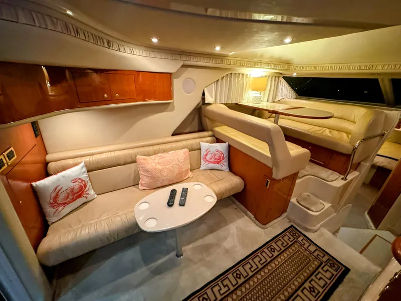 Slide: The Image of Luxurious 2001 Sea Ray 400 Sedan Bridge interior with cozy seating and elegant decor. - 41
