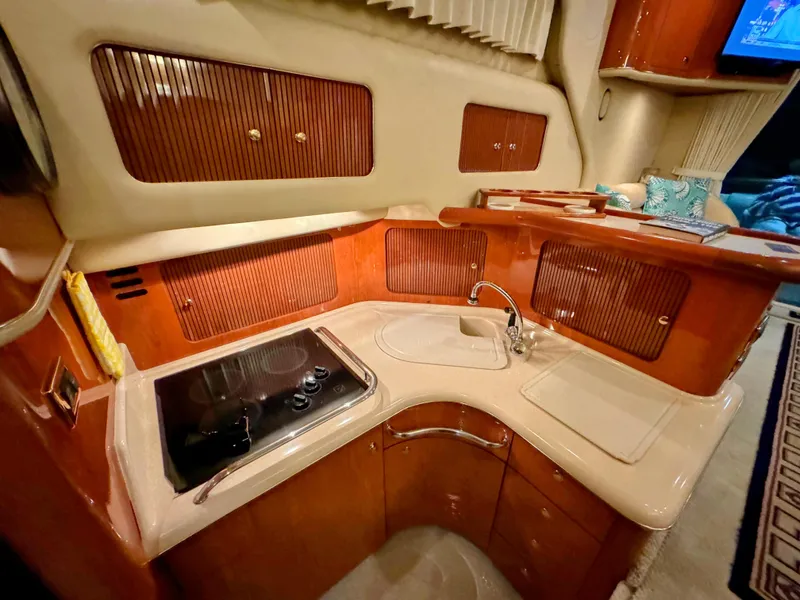 Slide: The Image of Luxurious kitchen interior of 2001 Sea Ray 400 Sedan Bridge yacht. - 46