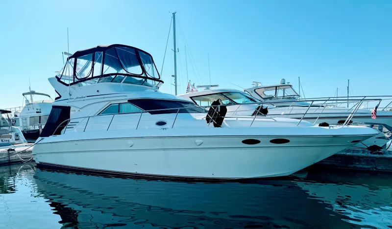 Slide: The Image of 2001 Sea Ray 400 Sedan Bridge yacht docked at marina. - 6