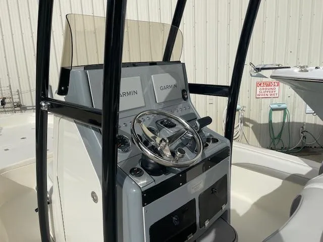 Slide: The Image of Center console of a 2022 ShearWater 25 boat with Garmin navigation systems. - 9