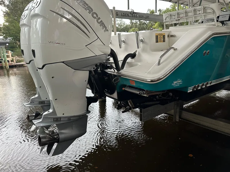 Slide: The Image of 2008 Palmetto 33 boat with dual Mercury outboard engines on a lift. - 10