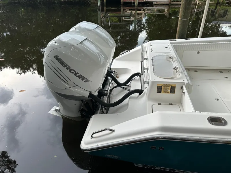Slide: The Image of 2008 Palmetto 33 boat with Mercury outboard engine on calm water. - 23