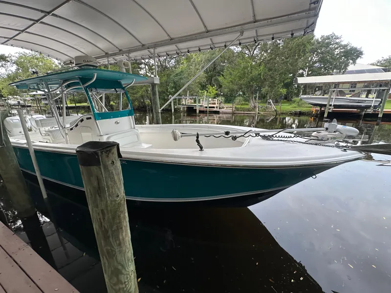 Slide: The Image of 2008 Palmetto 33 boat docked under canopy, side view. - 26