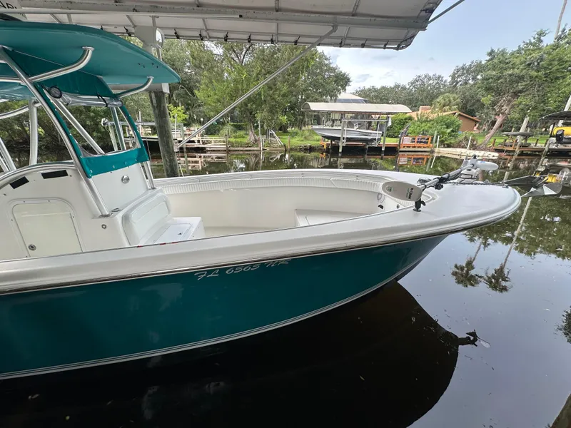 Slide: The Image of 2008 Palmetto 33 boat docked on a calm river under a canopy. - 29