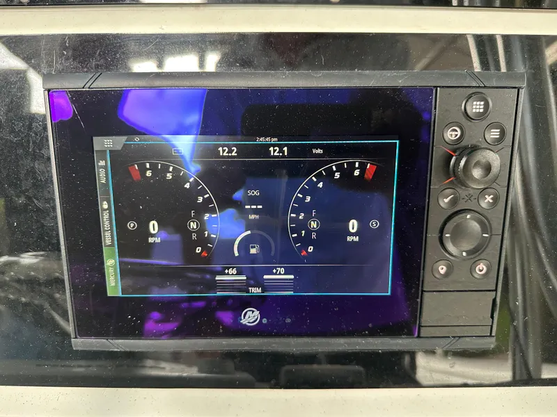 Slide: The Image of Boat dashboard display of a 2008 Palmetto 33 with digital gauges and controls. - 37