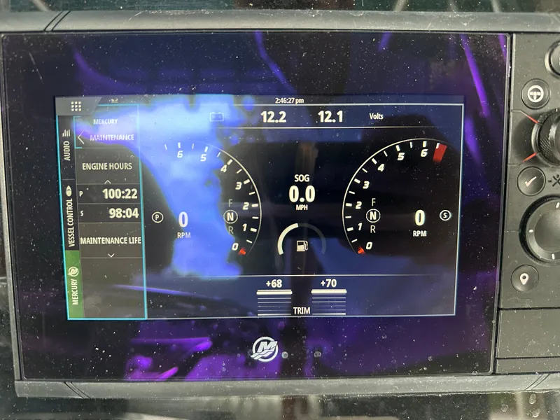 Slide: The Image of Boat dashboard display showing engine hours and RPM gauges, Palmetto 33, 2008 model. - 39