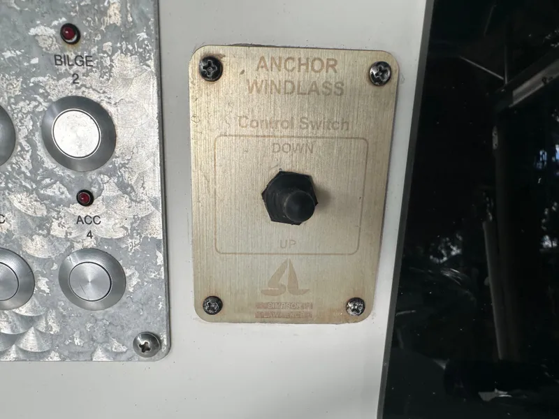Slide: The Image of Anchor windlass control switch on 2008 Palmetto 33 boat dashboard. - 43