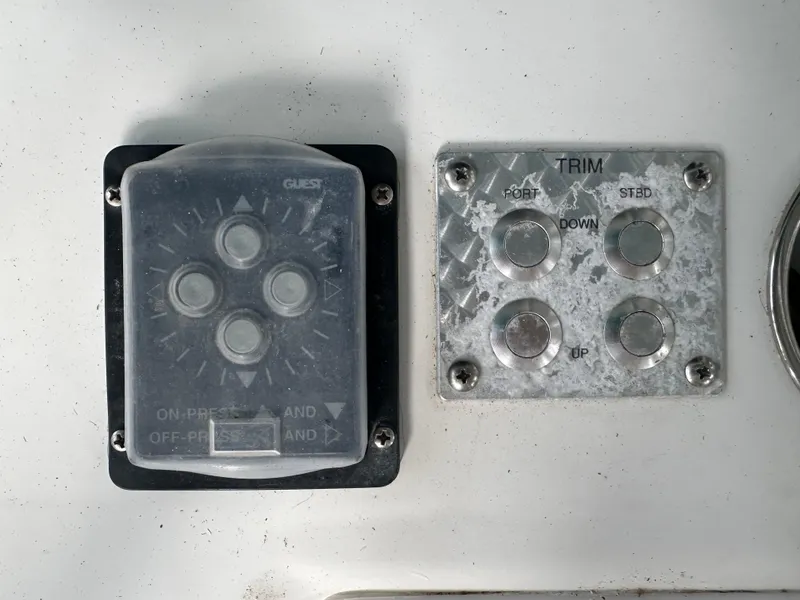 Slide: The Image of Boat control panel with trim buttons, Palmetto 33, 2008 model. - 45