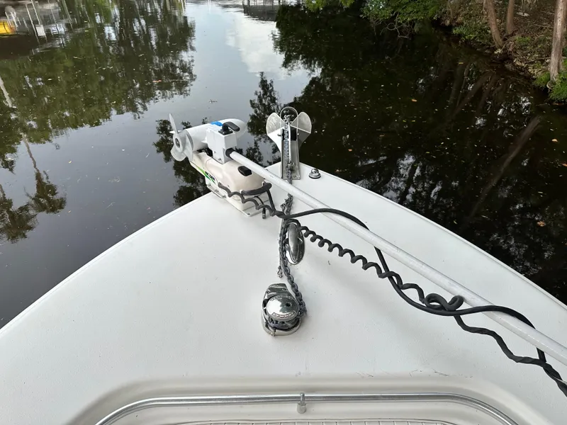 Slide: The Image of Bow of 2008 Palmetto 33 boat with anchor and trolling motor on calm water. - 49