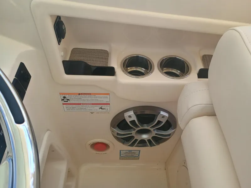 Slide: The Image of Interior of 2025 Grady-White Freedom 307 boat with cup holders and speaker. - 10