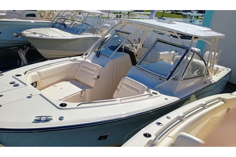 Slide: The Image of 2025 Grady-White Freedom 307 boat with spacious seating and sleek design. - 2