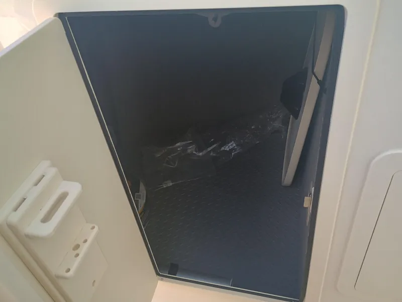 Slide: The Image of Open storage compartment on 2025 Grady-White Freedom 307 boat. - 22