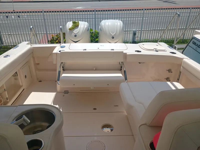 Slide: The Image of 2025 Grady-White Freedom 307 boat interior with seating and storage features. - 26