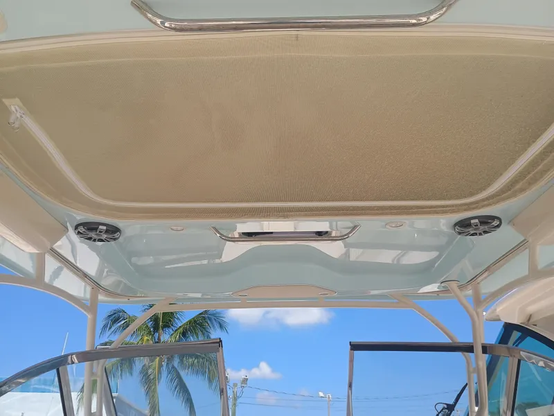 Slide: The Image of 2025 Grady-White Freedom 307 boat interior with speakers and open sky view. - 27