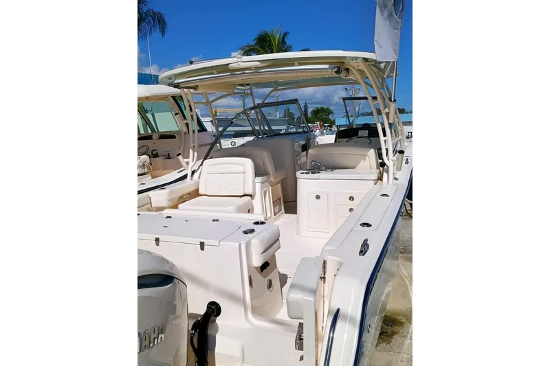 Slide: The Image of 2025 Grady-White Freedom 307 boat with spacious seating and modern design. - 3