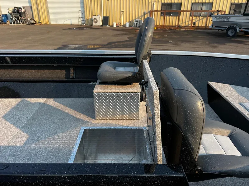 Slide: The Image of 2025 Fish Rite Angler 18 boat interior with seating and storage compartments. - 13