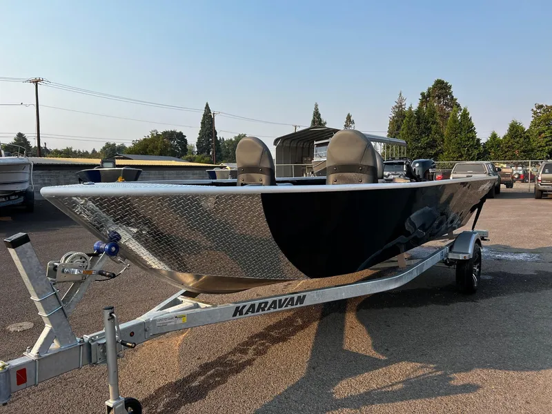 Slide: The Image of 2025 Fish Rite Angler 18 boat on Karavan trailer in parking lot. - 4