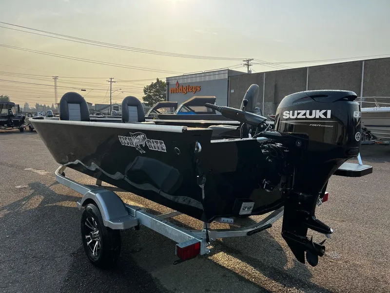 Slide: The Image of 2025 Fish Rite Angler 18 boat with Suzuki motor on trailer in parking lot. - 6