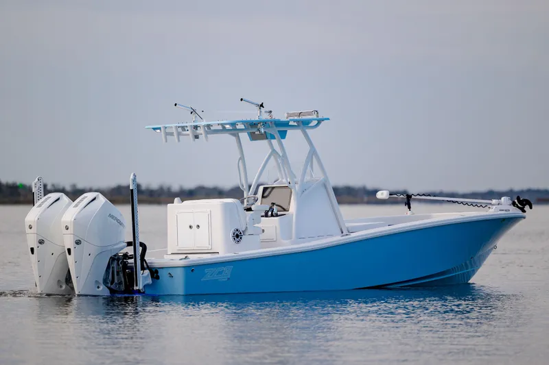 Slide: The Image of 2021 ZCB 26 Freemason boat with dual engines on calm water. - 10